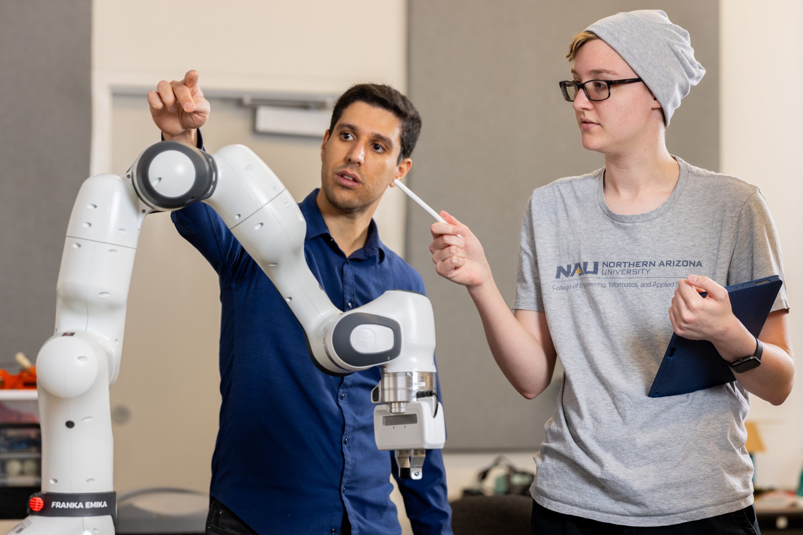 NAU engineering students work together at the Flagstaff Campus robotics lab.
