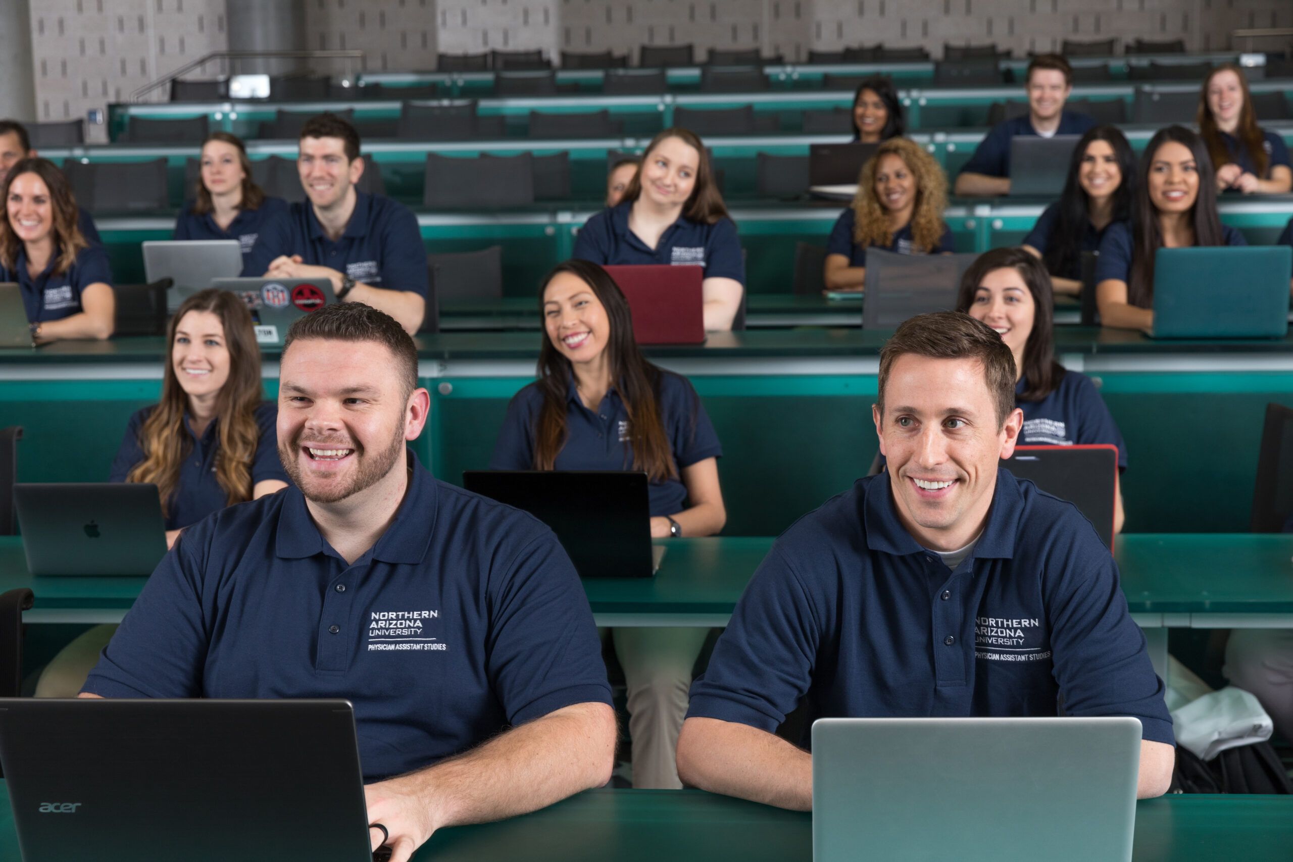 NAU Physician Assistant Studies students smile during a class on campus.