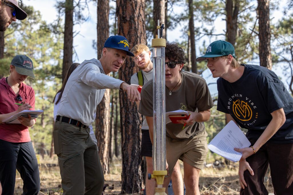 Hydrology students test soil during class.