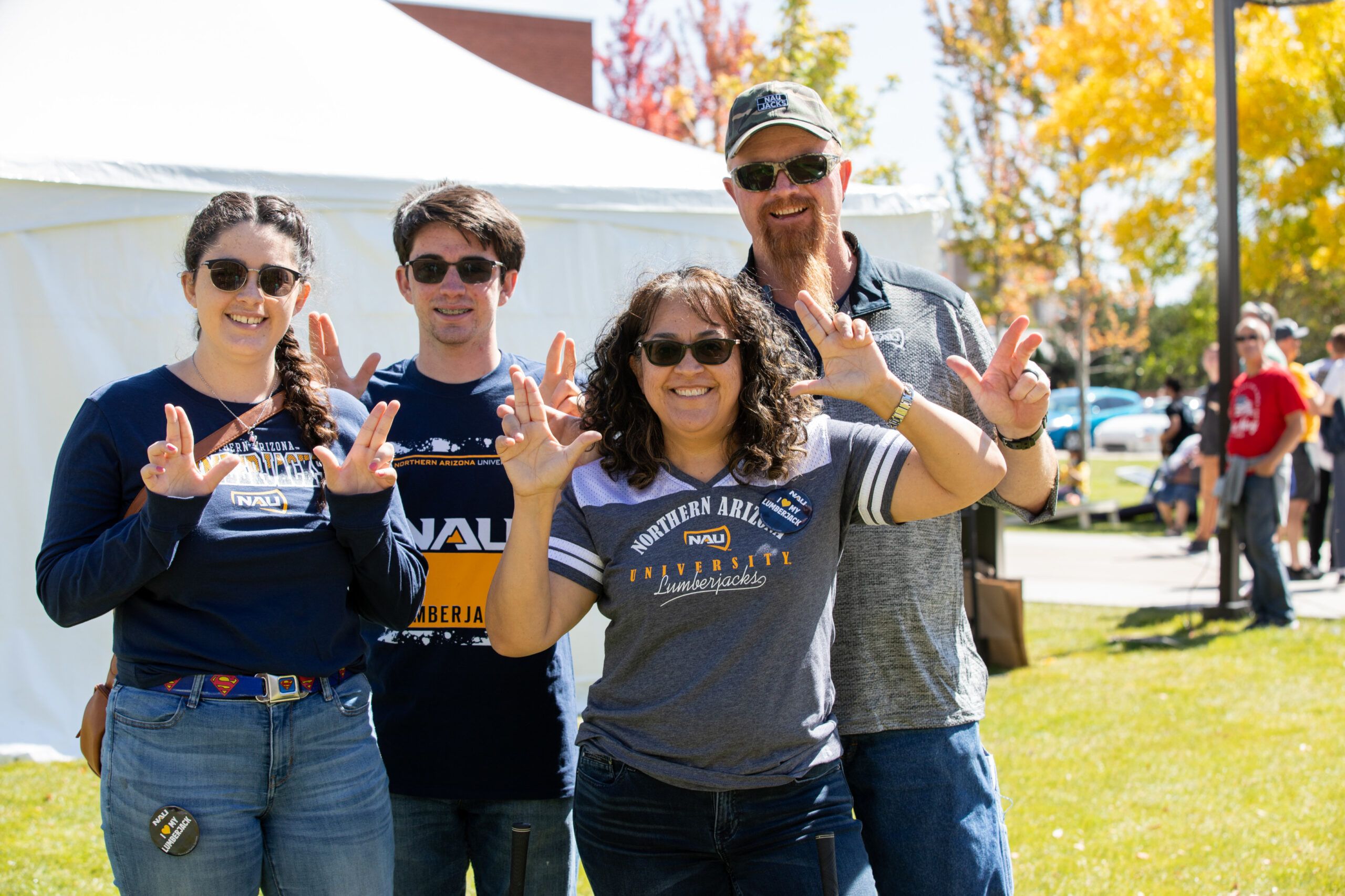 A family takes a picture together during family weekend at NAU.