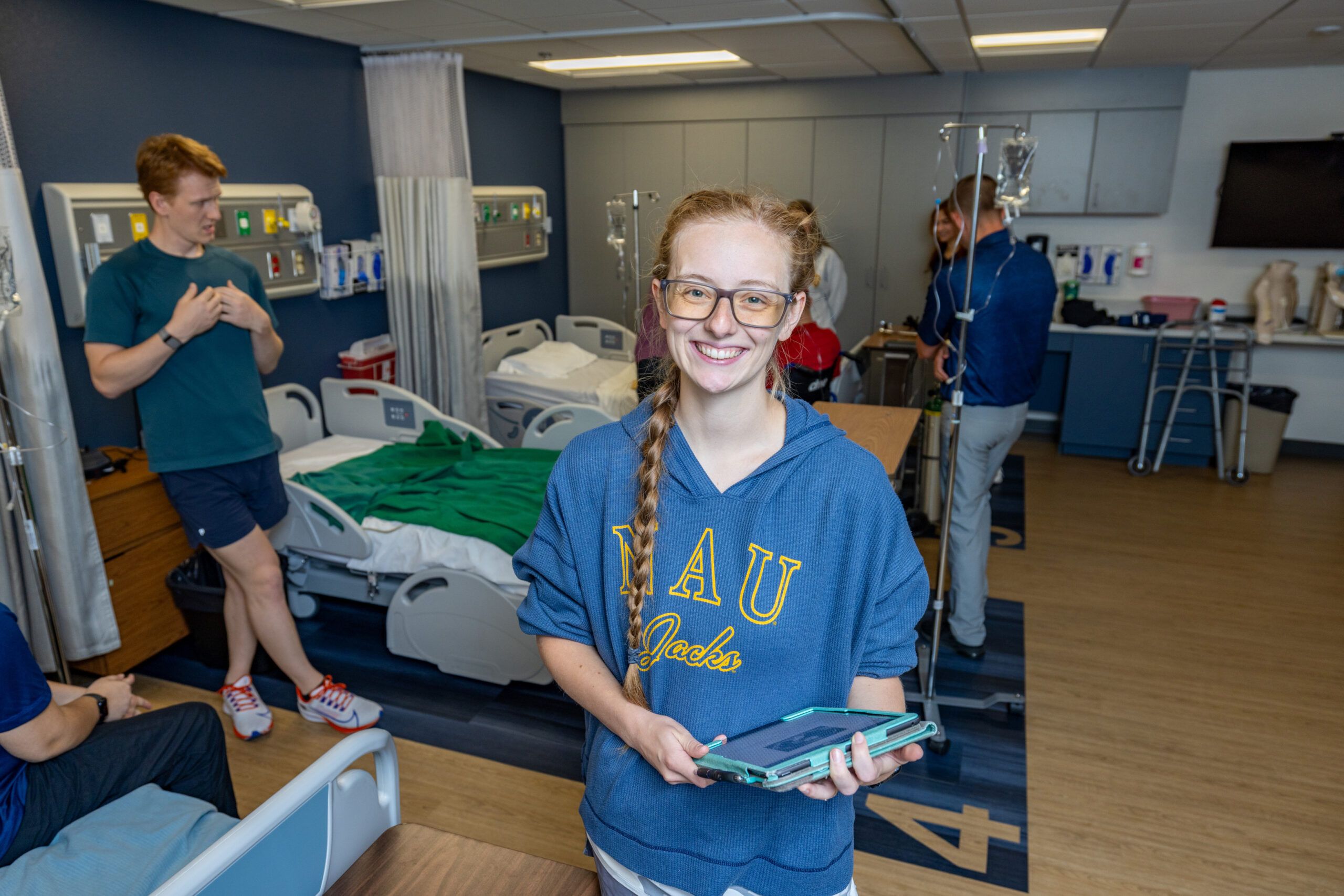 Sara Thomasson, Doctor of Physical Therapy Program, holds a clipboard and smiles for the camera.