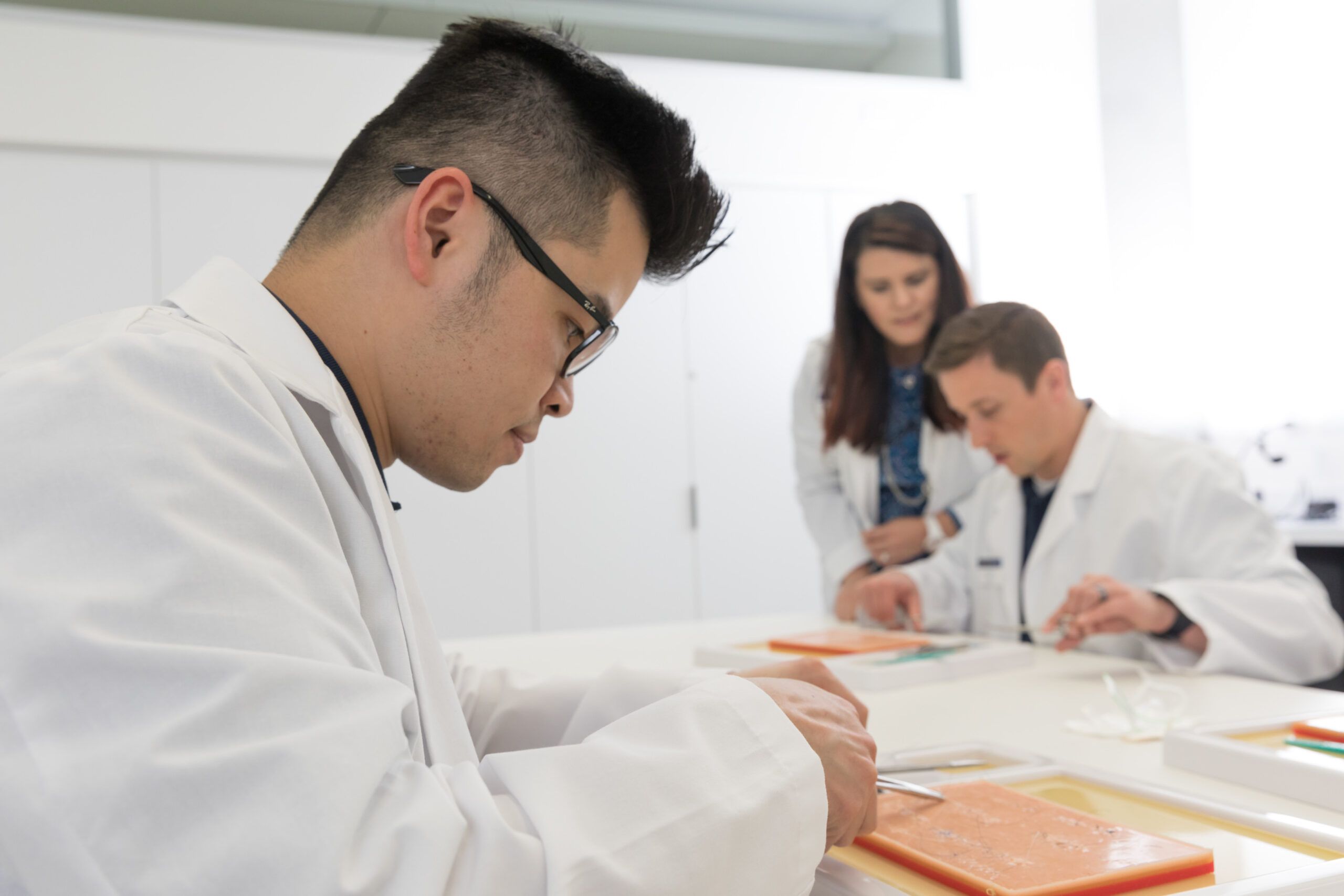 Physician assistants work together at the Phoenix Bioscience Core.