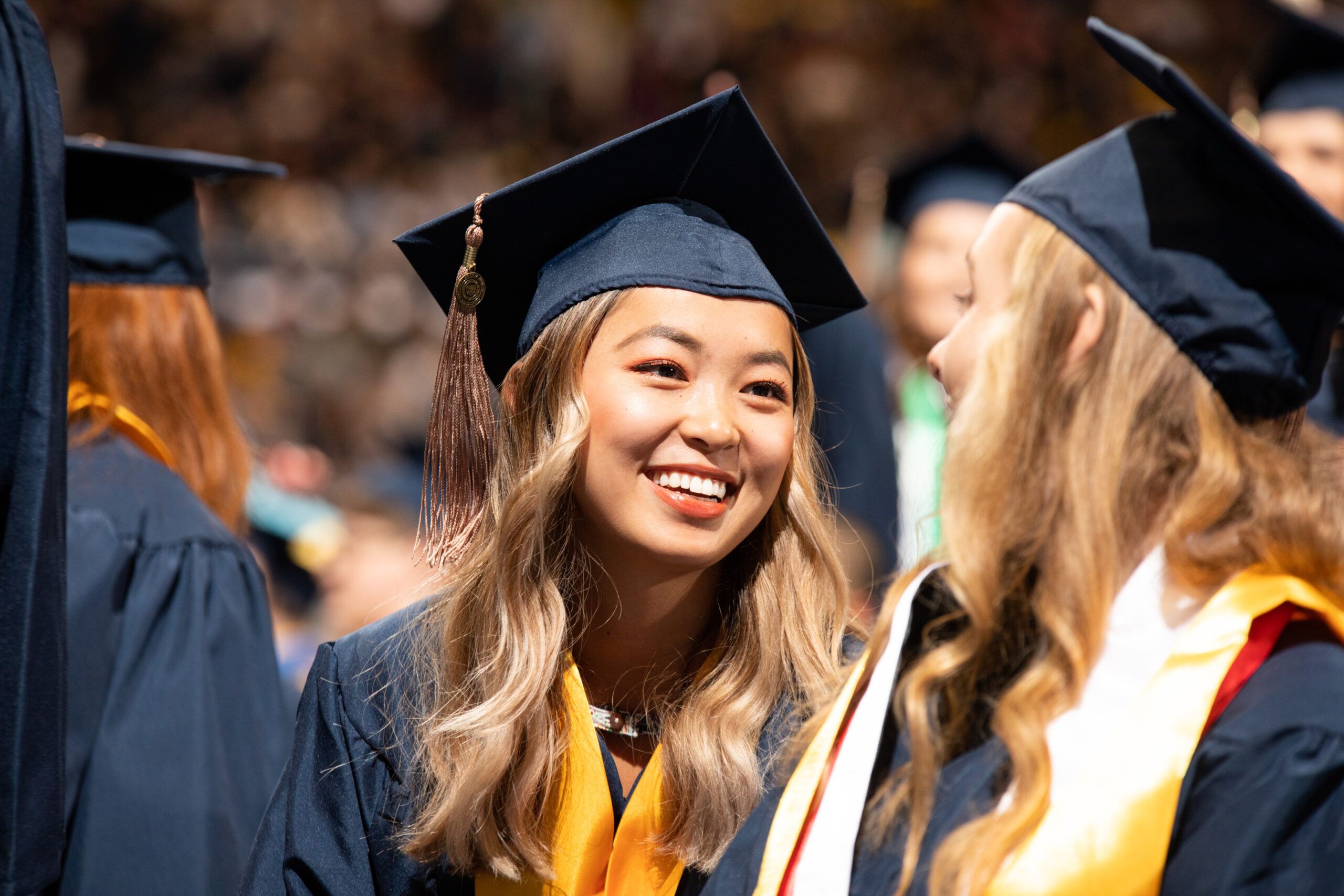 Students celebrating at commencement at NAU.